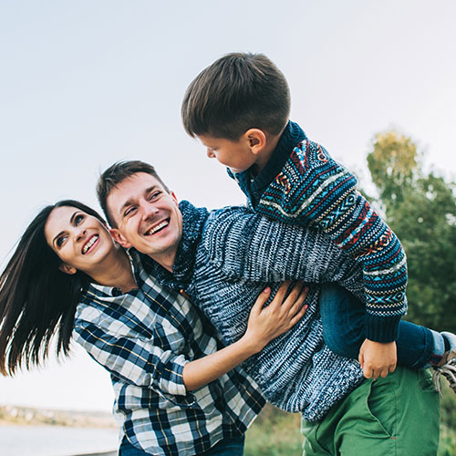 happy-father-mother-son-by-lake happy father mother son by lake