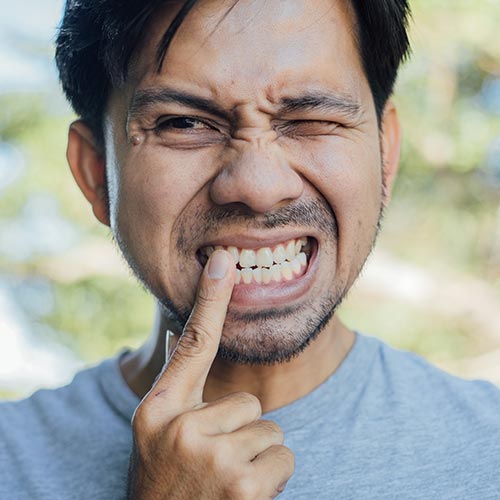 man-in-dental-emergency young girl with invisible braces