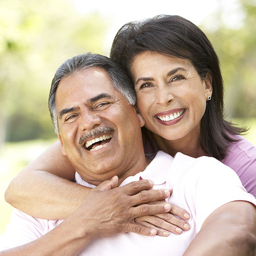 mature-couple-laughing-together young girl with invisible braces